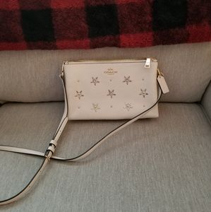 Coach cross body purse ivory with bejeweled flowers or snowflakes
